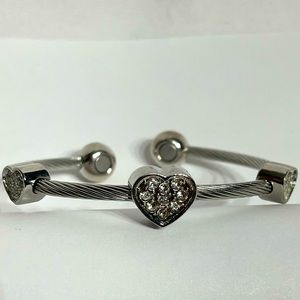 Silver tone magnetic cuff bracelet with 3 gem studded heart charms therapeutic